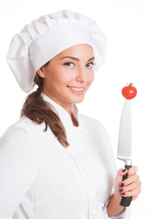 Portrait of a young brunette chef woman isolated on white background.の写真素材