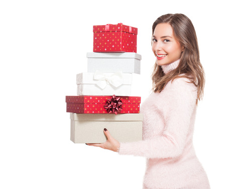 Christmas fun with brunette beauty isolated on white background.の写真素材