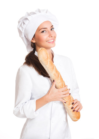 Portrait of a young brunette chef woman isolated on white background.の写真素材