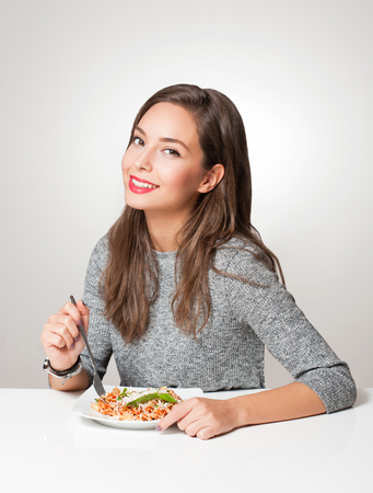 Gorgeous young brunette woman having Italian food.の写真素材