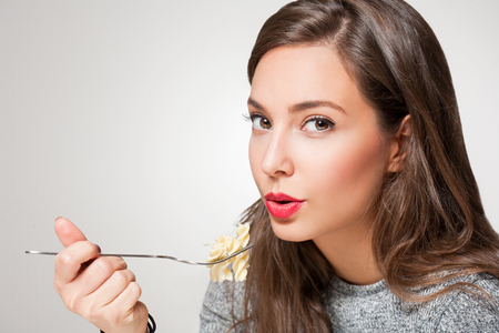 Gorgeous young brunette woman having Italian food.の写真素材