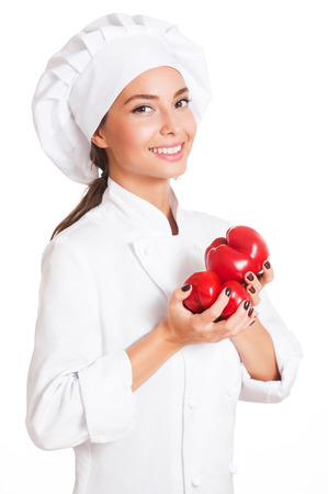 Portrait of a beautiful young brunette chef woman.の写真素材