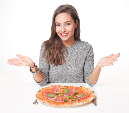 Beautiful young brunette woman eating Italian meal.の写真素材