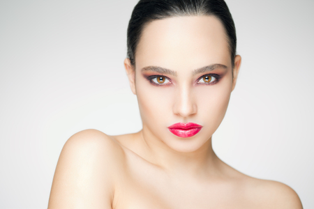 Portrait of a brunette makeup beauty with dark eye shade.の写真素材