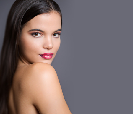 Gorgeous young brunette woman in makeup with ombre lipstick.の写真素材