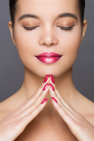 Gorgeous young brunette woman in makeup with ombre lipstick.の写真素材