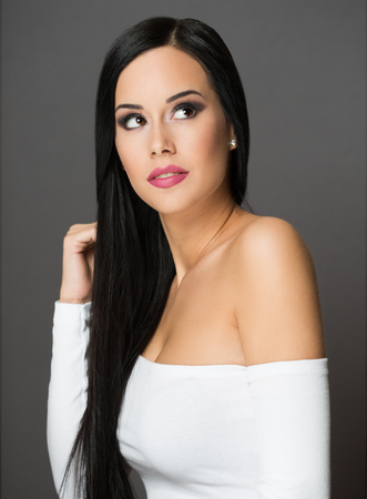 Gorgeous young brunette woman in festive makeup.の写真素材