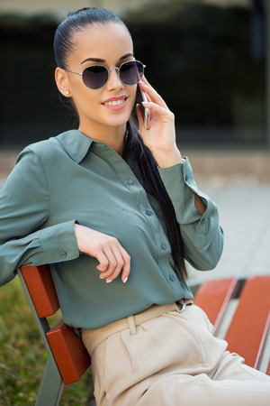 Outdoors portait of stylish young fashion  brunette.の写真素材