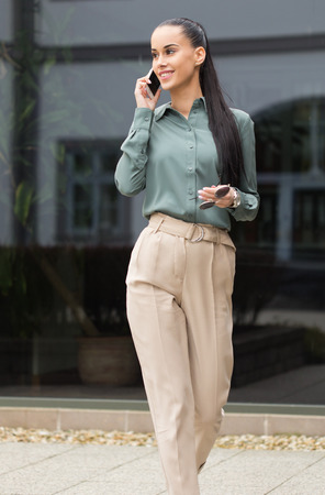 Outdoors portait of stylish young fashion  brunette.の写真素材