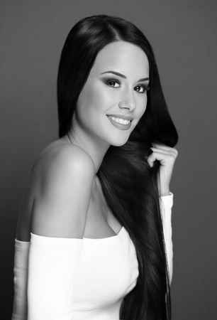 Studio portrait of young brunette cosmetics beauty.の写真素材