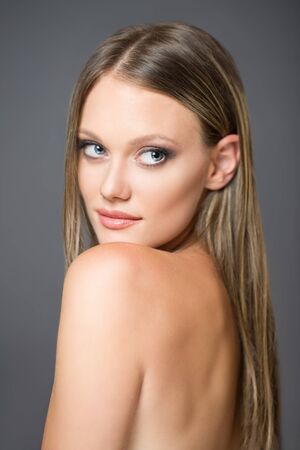 Portrait of a blond cosmetics beauty in light makeup.の写真素材