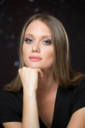 Portrait of a blond cosmetics beauty in light makeup.の写真素材