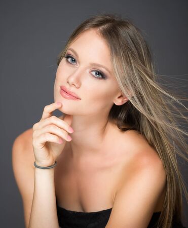 Portrait of a blond cosmetics beauty in light makeup.の写真素材