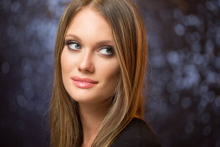 Portrait of a blond cosmetics beauty in light makeup.の写真素材