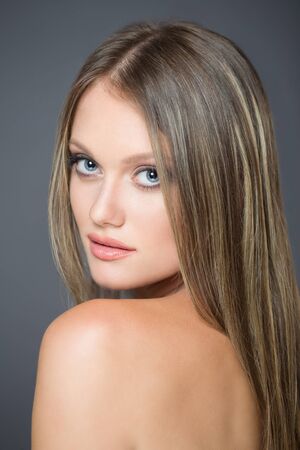 Portrait of a blond cosmetics beauty in light makeup.の写真素材