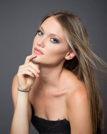 Portrait of a blond cosmetics beauty in light makeup.の写真素材
