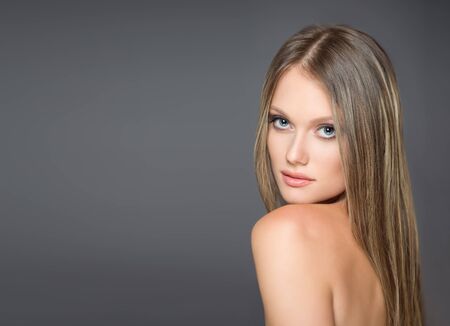 Portrait of a blond cosmetics beauty in light makeup.の写真素材