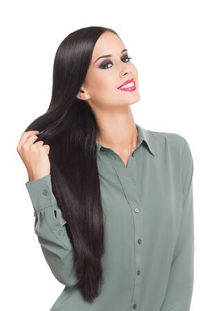 Portrait of a brunette beauty showing off amazing long hair.の写真素材