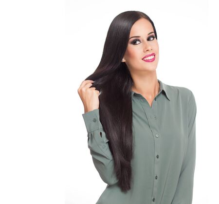 Portrait of a brunette beauty showing off amazing long hair.の写真素材