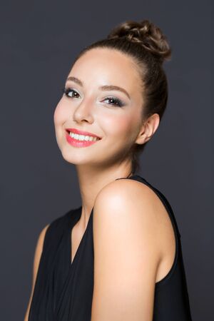 Portrait of a gorgeous brunette in elegant makeup.の写真素材