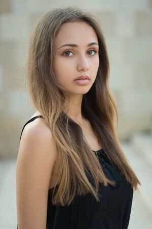 Portrait of a young gorgeous summer fashion brunette outdoors.の写真素材