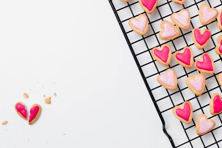 Broken heart shape cookie for Valentines Day on white backgroundの写真素材