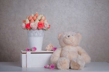 Fruit bouquet decoration with teddy bear toy on the table