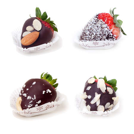 Collage of strawberries covered with dark chocolate with coconut flakes and nuts on white backgroundの写真素材