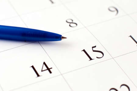 Closeup of calendar page with pen near data 15-th; small depth of field.の写真素材