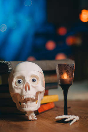 Halloween party decoration with human skull and candleの写真素材