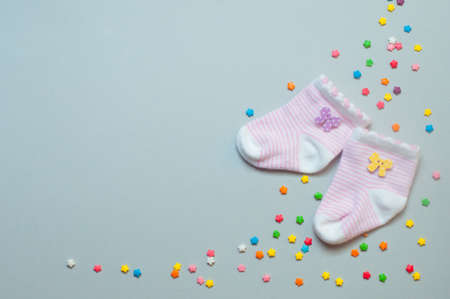 Baby girl accessories concept: socks over gray background with copy space; top view, flat lay.の写真素材