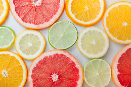 Close up of fresh orange, grapefruit, lime and lemon slicesの写真素材