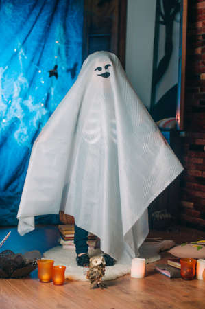 Portrait of little girl in a costume of ghost