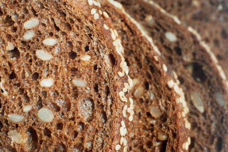 Close up of sliced bread with sunflower seeds; bread texture as a backgroundの写真素材