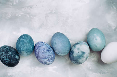Happy Easter card: Series of eggs with marble stone effect painted with natural dye carcade flower...