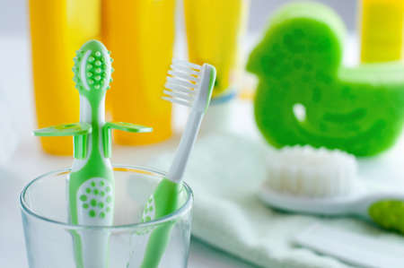 Closeup of baby's first toothbrushes in the bathroom selective focusの写真素材