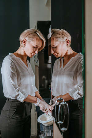 Professional hairdresser prepairing hair dye at hair salonの写真素材