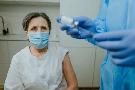 Healthcare worker waiting for  vaccination at hospitalの写真素材