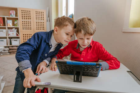 Elementary school students using tablet in the classroom