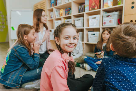 Elementary school students talking in the classroom