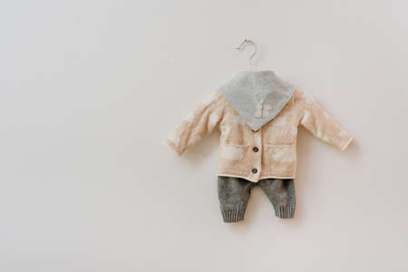 Kids clothes made from organic cotton on the rack on the white background with blank space for text.の写真素材