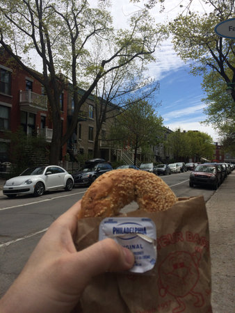St Viateur bagel and Philadelphia cheese package with Montreal city background. Montreal, Quebec, Canada. May 13, 2018.のeditorial素材