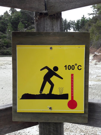 Warning sign. Erupting geysers with boiling 100 celsius water. Waiotapu, New Zealand.のeditorial素材