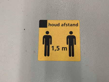 1,5 meters social distancing sign (houd afstand)) at Tilburg train station bicycles shed. Tilburg,...