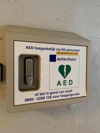 Automated external defibrillator (AED) mounted on the wall at the Gouda central train station. Gouda, South Holland / Netherlands.のeditorial素材