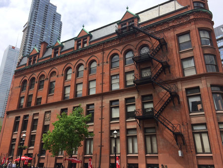 Historic red bricks thin Flatiron (Gooderham ) office building at downtown Toronto. Toronto, Ontario, Canadaのeditorial素材