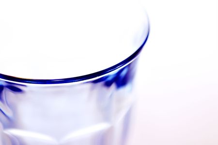 Blue glass on white background.の写真素材