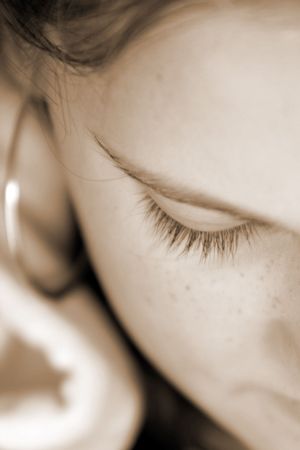 Girl looking down, sepiaの写真素材