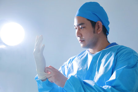 Surgeon working in operating room,closeup of hand and arm