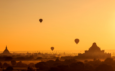 Beautiful flying hot air balloons during sunrise Bagan, Myanmarの写真素材